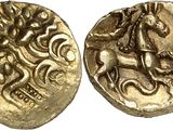a gold coin with a horse and rider on it