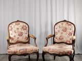 pair of louis xv style armchairs with floral upholstered upholstered cushions