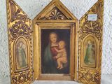 a picture of a picture of a woman holding a baby in a picture frame