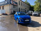 a blue car parked in front of a building