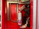 a red fire hydrant with a bunch of items inside of it