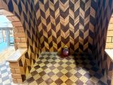 fireplace made out of wood with an apple on top of it