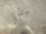 a silver plate that has a label on it
