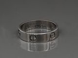 an image of a silver ring with the words love on it