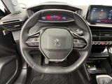 the interior of a car with a steering wheel and dashboard controls