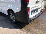 a white van that is parked on the side of the road