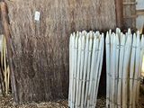 a lot of straw stacked on top of each other in a barn