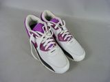 purple and white tennis shoes with white laces on a white surface