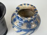 two vases sitting next to each other on a table
