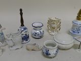 a lot of small blue and white items on the table