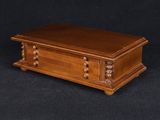 a wooden casket on a black background with a black background