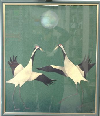 two birds that are standing in front of a window