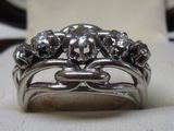 an image of a ring with diamonds on it