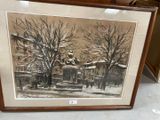 painting of a winter scene in a frame on a table