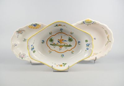 a white bowl with yellow and blue flowers on it