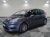 a picture of a car that is parked in a garage