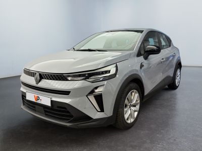 a silver car is parked in a room with a black floor