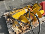 a yellow machine that is sitting on a pallet