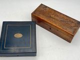 an old wooden box with a blue cover and a brown lid