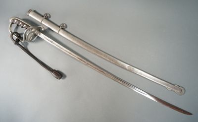 two swords that are laying on a table