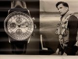 advertisement for breiter watches displayed on a wall in a store