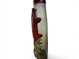 a glass vase with a picture of a fish on it