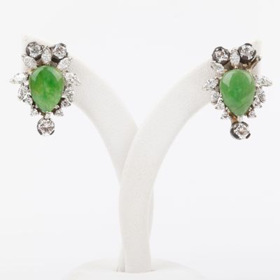 a pair of green jade and diamond earrings