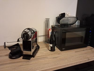 a picture of a kitchen counter with a microwave and a coffee maker
