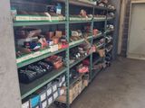 many shelves with various items in them in a garage