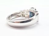 an image of a ring with a blue stone in the middle