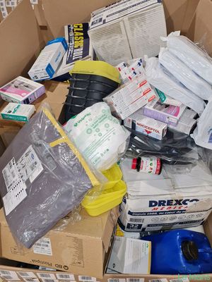 a cardboard box full of items that are sitting on the floor