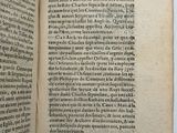 an open book with a black and white image of a man ' s face on it