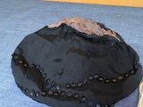 a hat that is sitting on the floor next to a pair of shoes