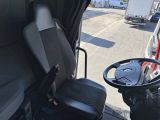 a truck with a driver ' s seat in the back of it