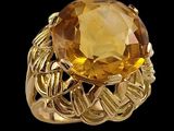 an image of a gold ring with a large citrine stone