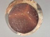 a close up of a small metal object on a table