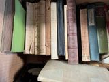 a lot of books that are sitting on a shelf