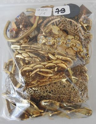 a bag of gold jewelry in it on a table
