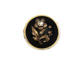 an image of a black and gold ring with a flower on it