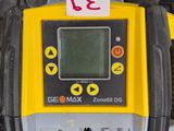 a yellow and black electronic device with a red sticker on it