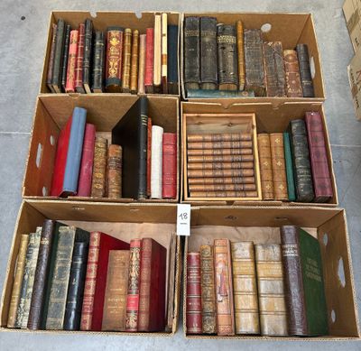 several boxes of books are stacked on top of each other