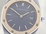 an image of a silver and gold watch on a white background