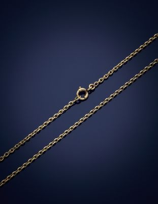 a gold chain with a clasp on a dark background