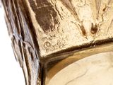 a close up of a gold clock with a horse on it ' s face
