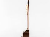 a sculpture of a crucif on a wooden stand with a cross on it