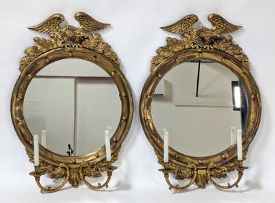 pair of antique gold mirrors with eagle heads and candlesticks