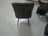 a chair that is sitting in the middle of a room