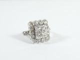 a close up of a diamond ring on a white surface