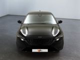 the front view of a black car in a white room