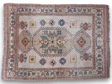 an old rug with many different colors and patterns